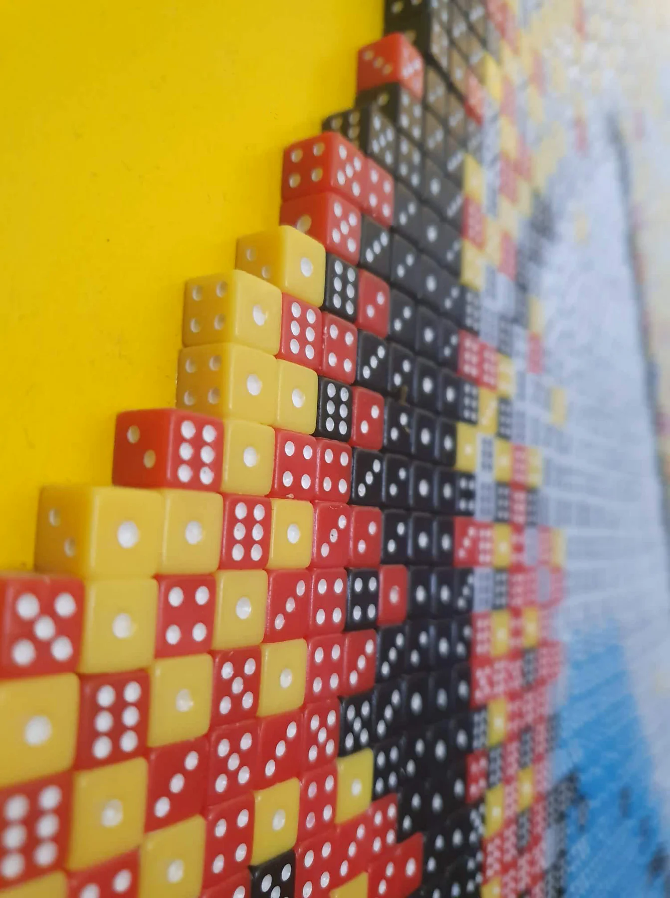 Close-up of dice in Divine by Eyal Alef Ophir